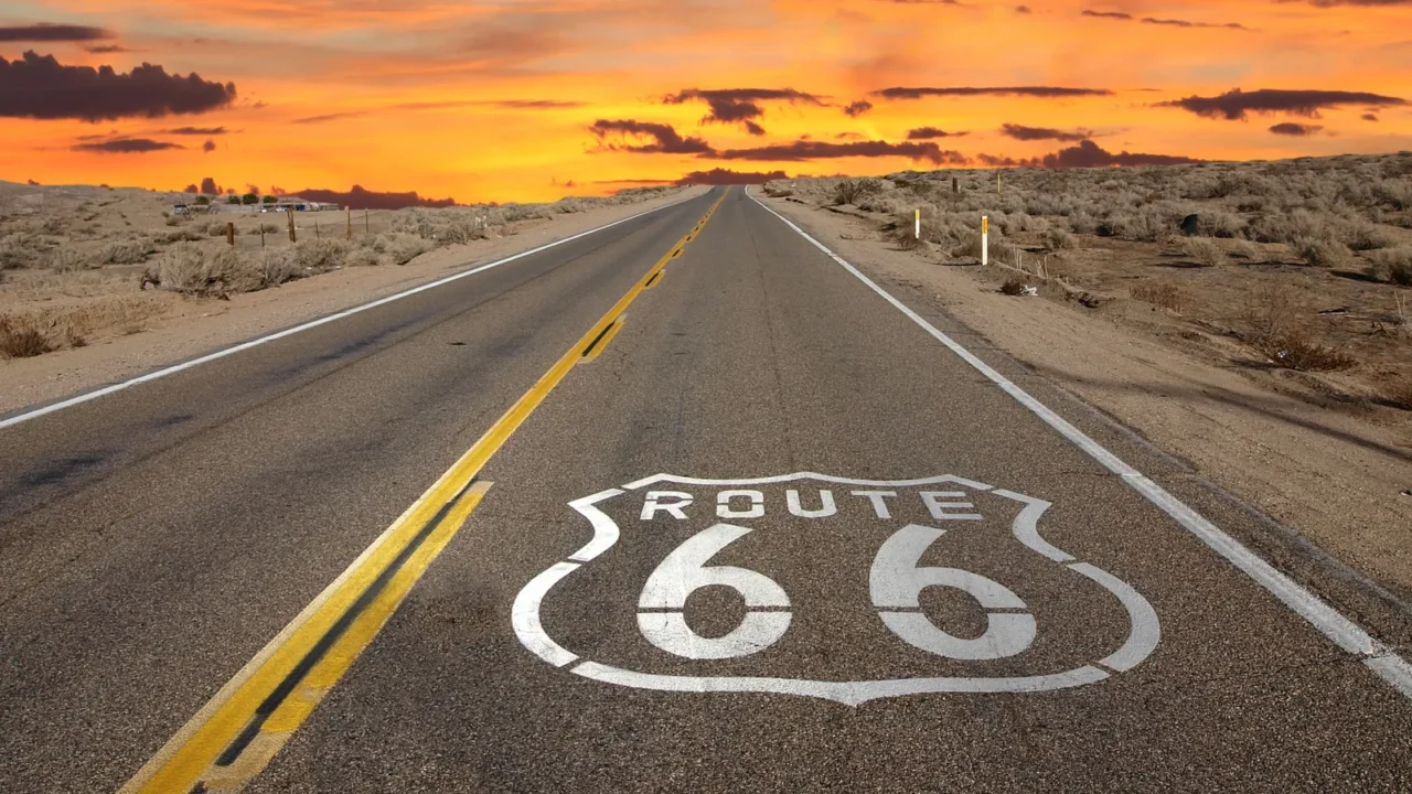 route 66 pavement sign sunrise mojave desert