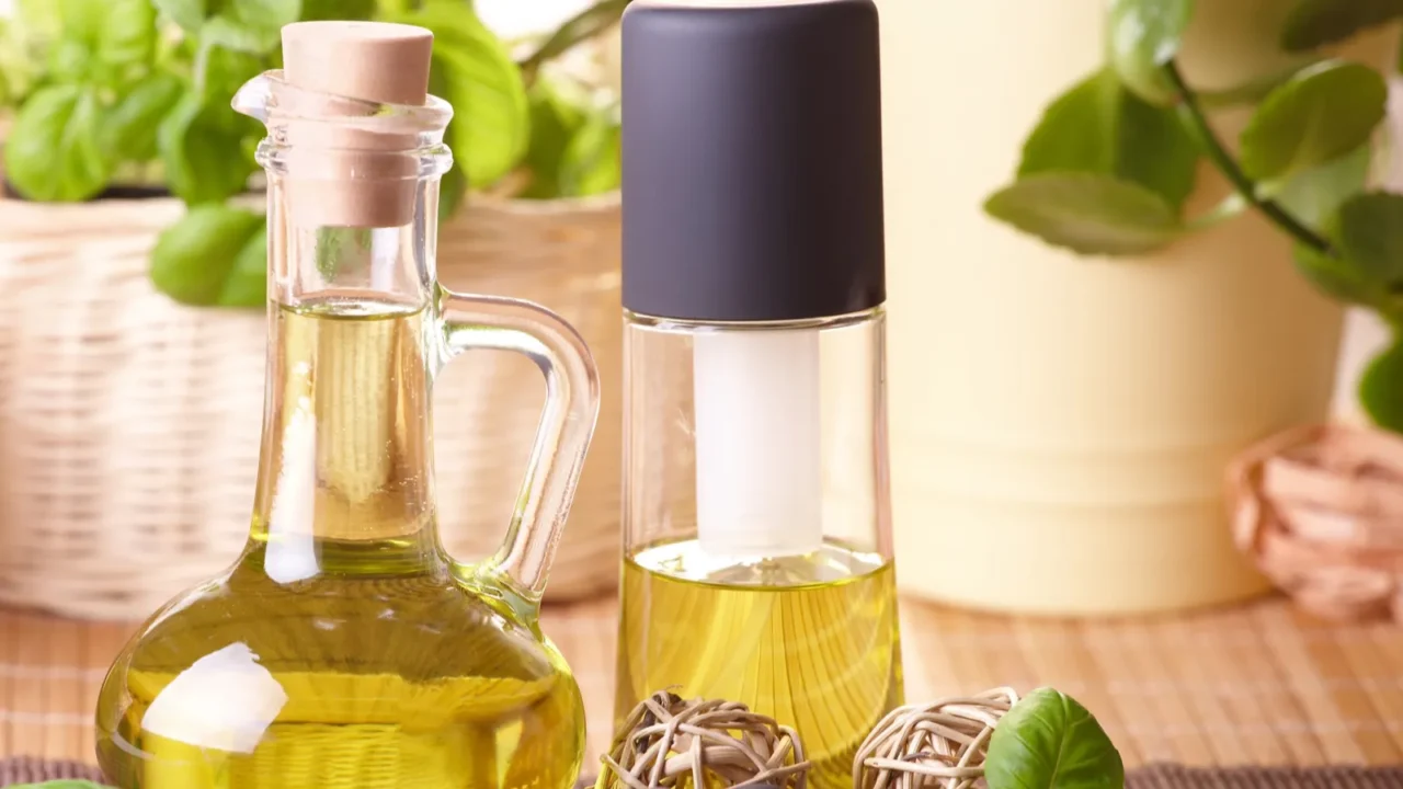 two bottles with olive oil and grape seed oil