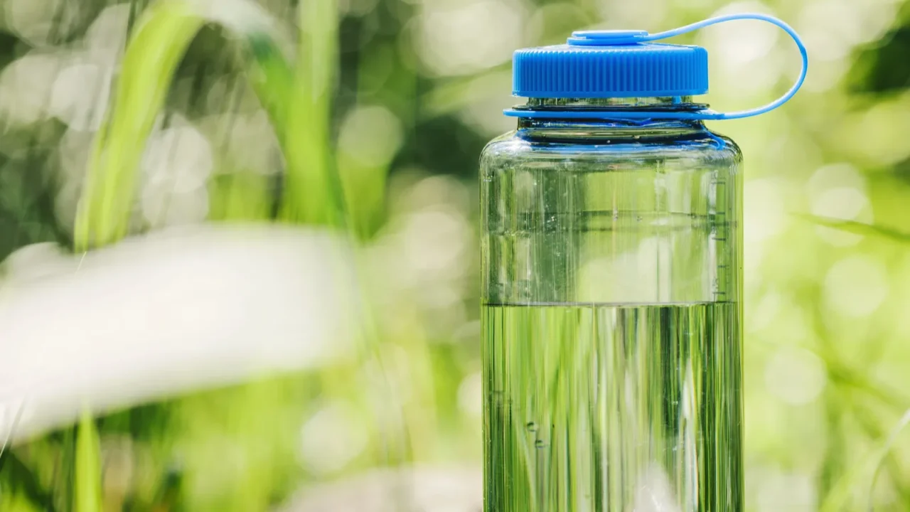 water bottle on wood with summer