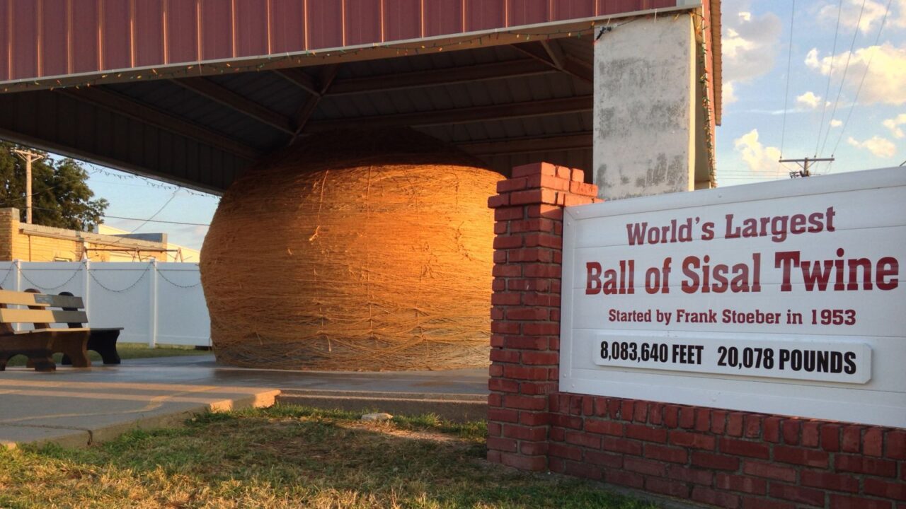 The world's largest ball of sisal twine sits proudly under a protective canopy in Cawker City, KS.