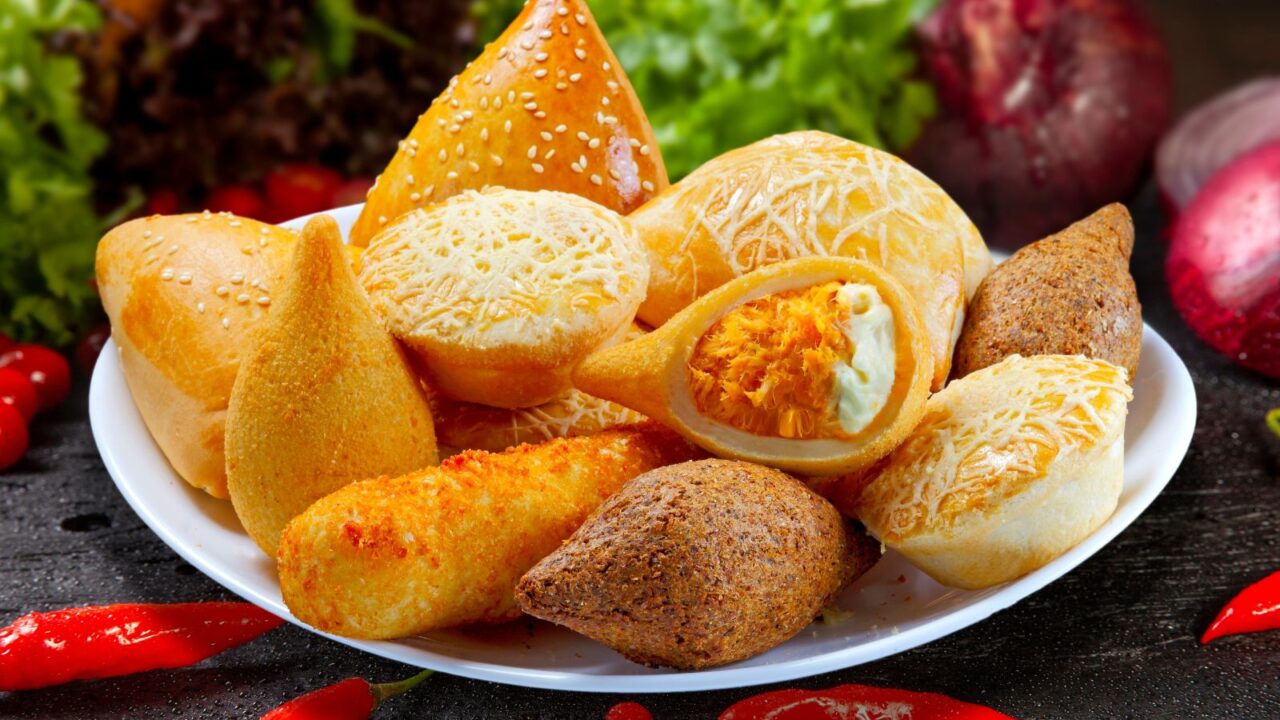 Brazilian snacks, esfirra, kebab, patty, coxinha, sausage wrapped. rocharibeiro