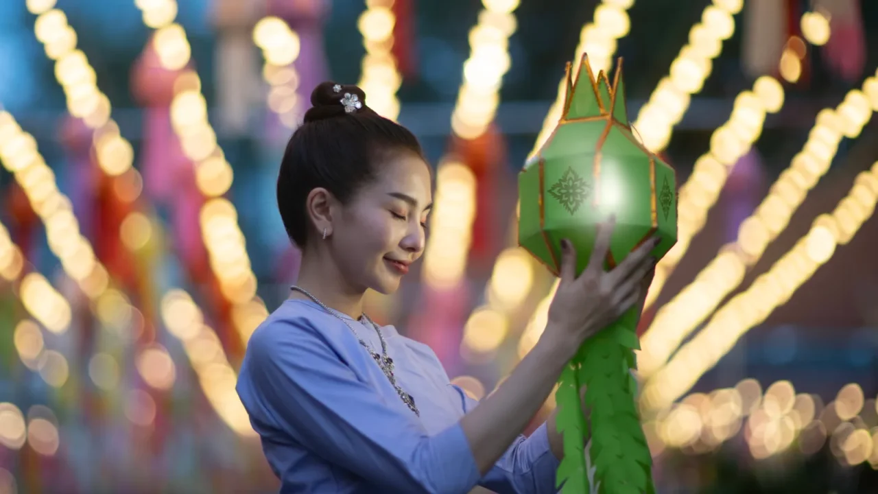 beautiful asian women holding a traditional paper lantern during yi