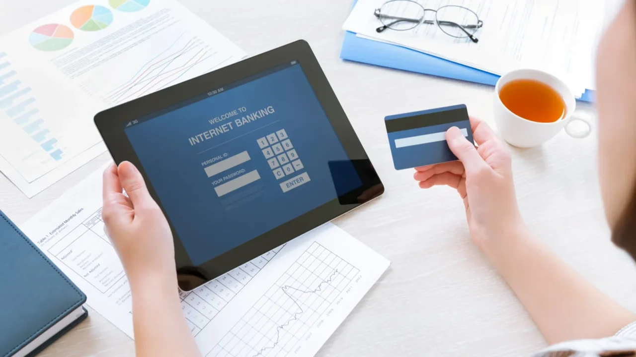 businesswoman using a credit card for online internet banking