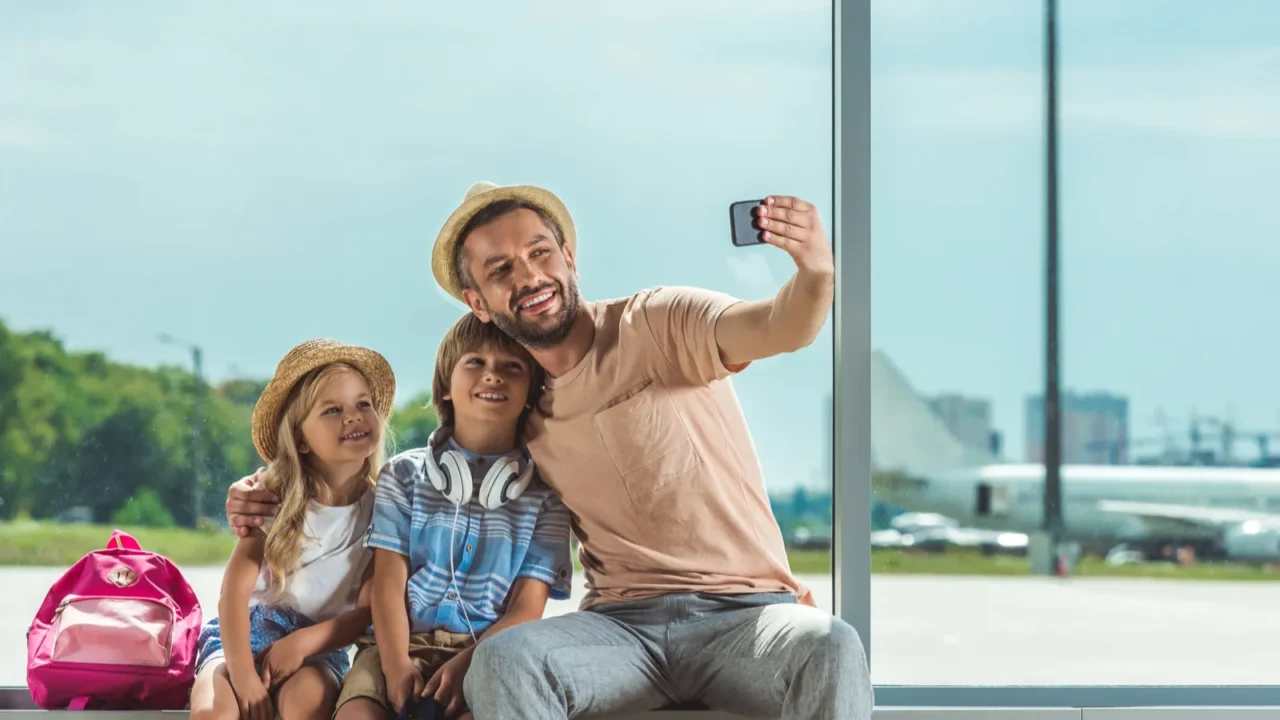 family taking selfie in airport
