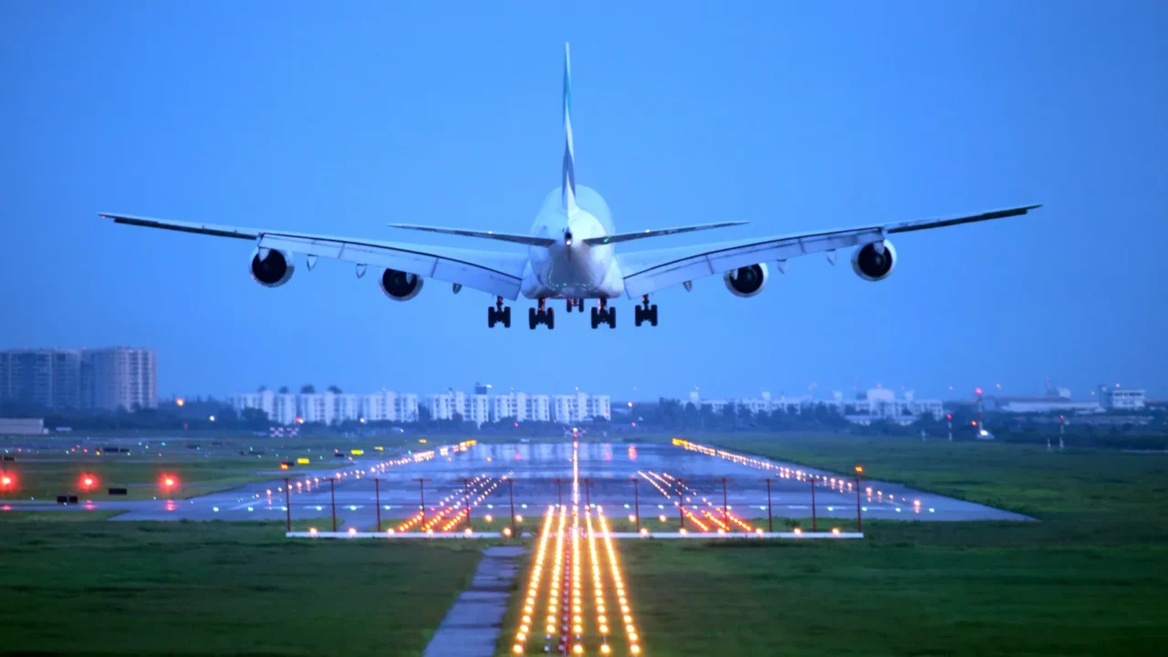 passenger plane fly up over takeoff runway from airport