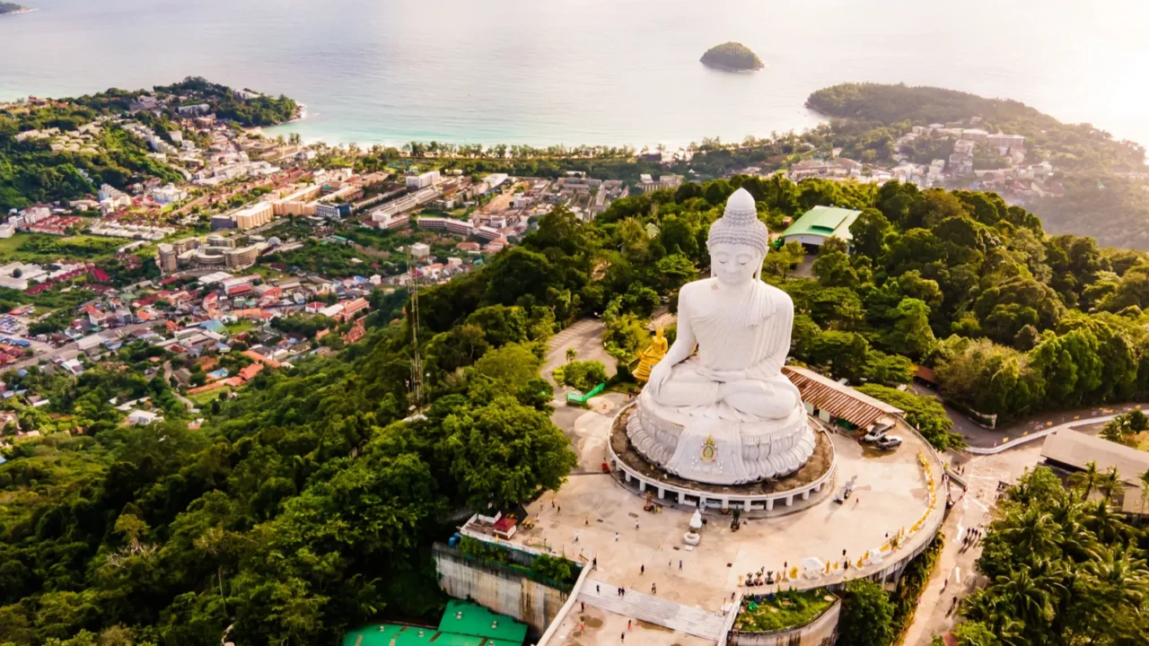 phuket big buddha statue afternoon light sky and blue ocean