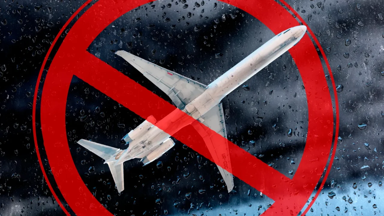 the plane against a background of thunderclouds and a prohibiting