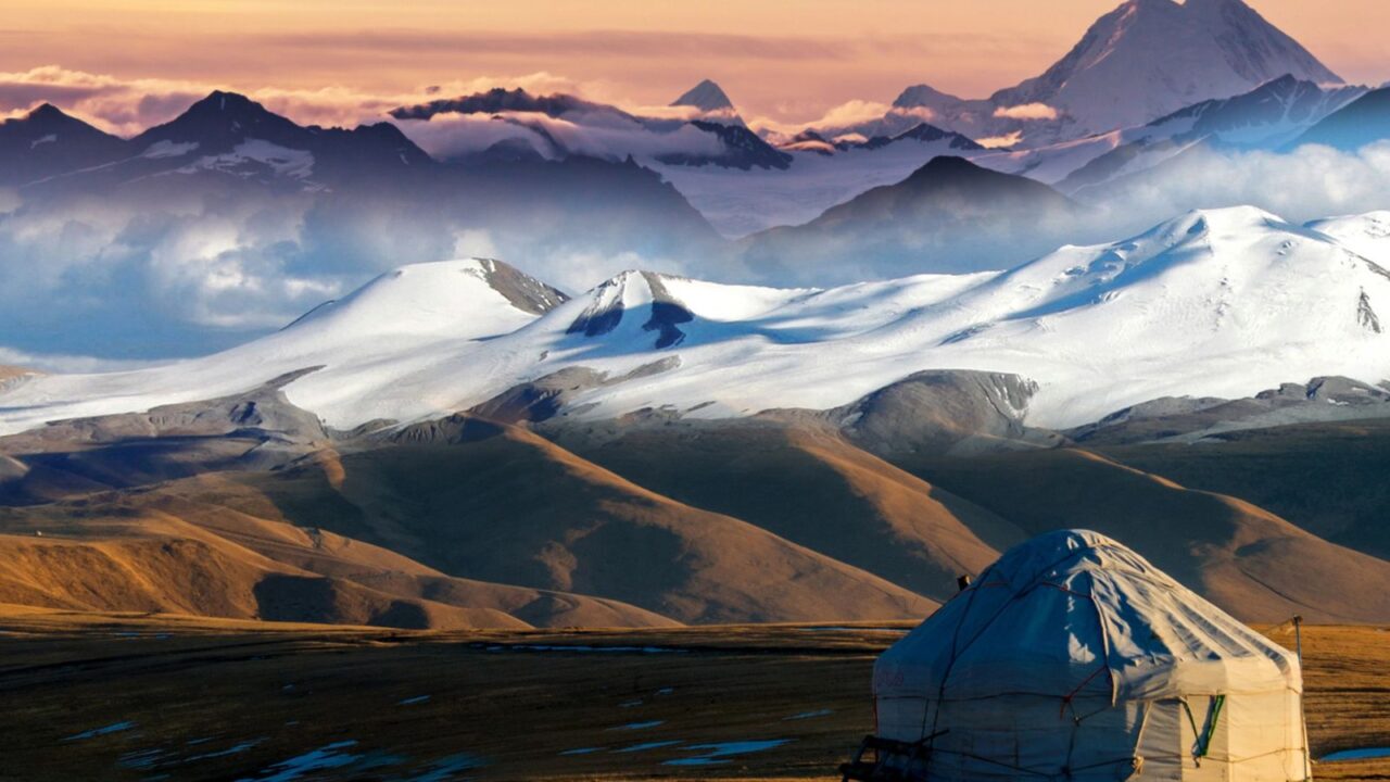 Yurt with mountains on background in Central Asian.