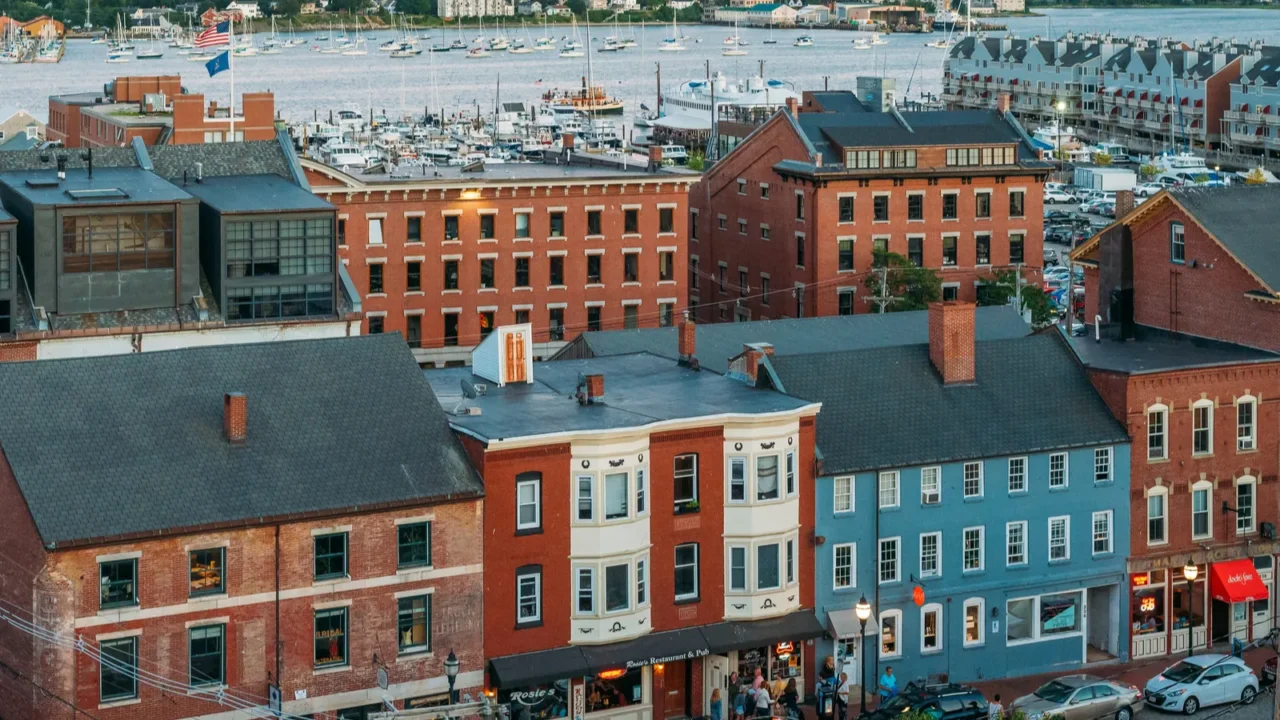 a sunset view of downtown and the harbor in portland
