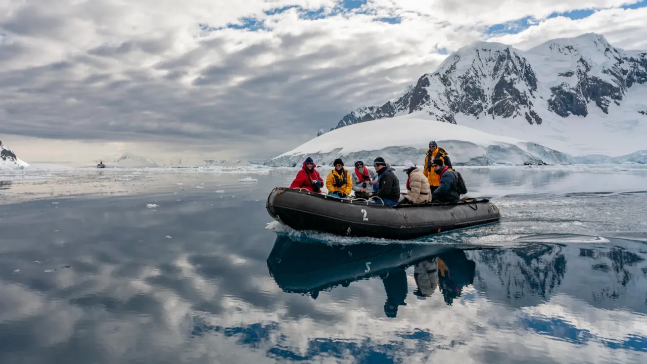 Adventure tourists in Pleneau Bay in the Lamaire Channel in Antarctica.