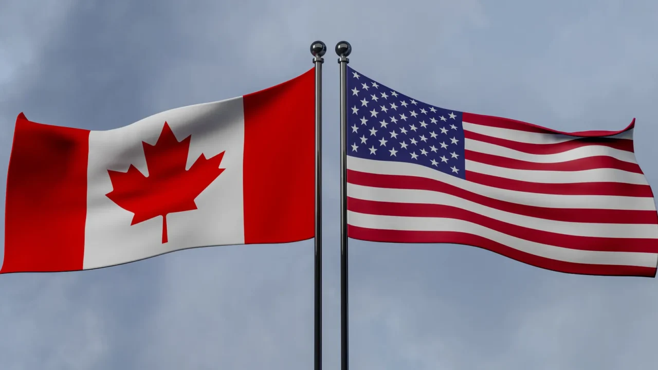 canada and usa flags blue sky and flag canada vs