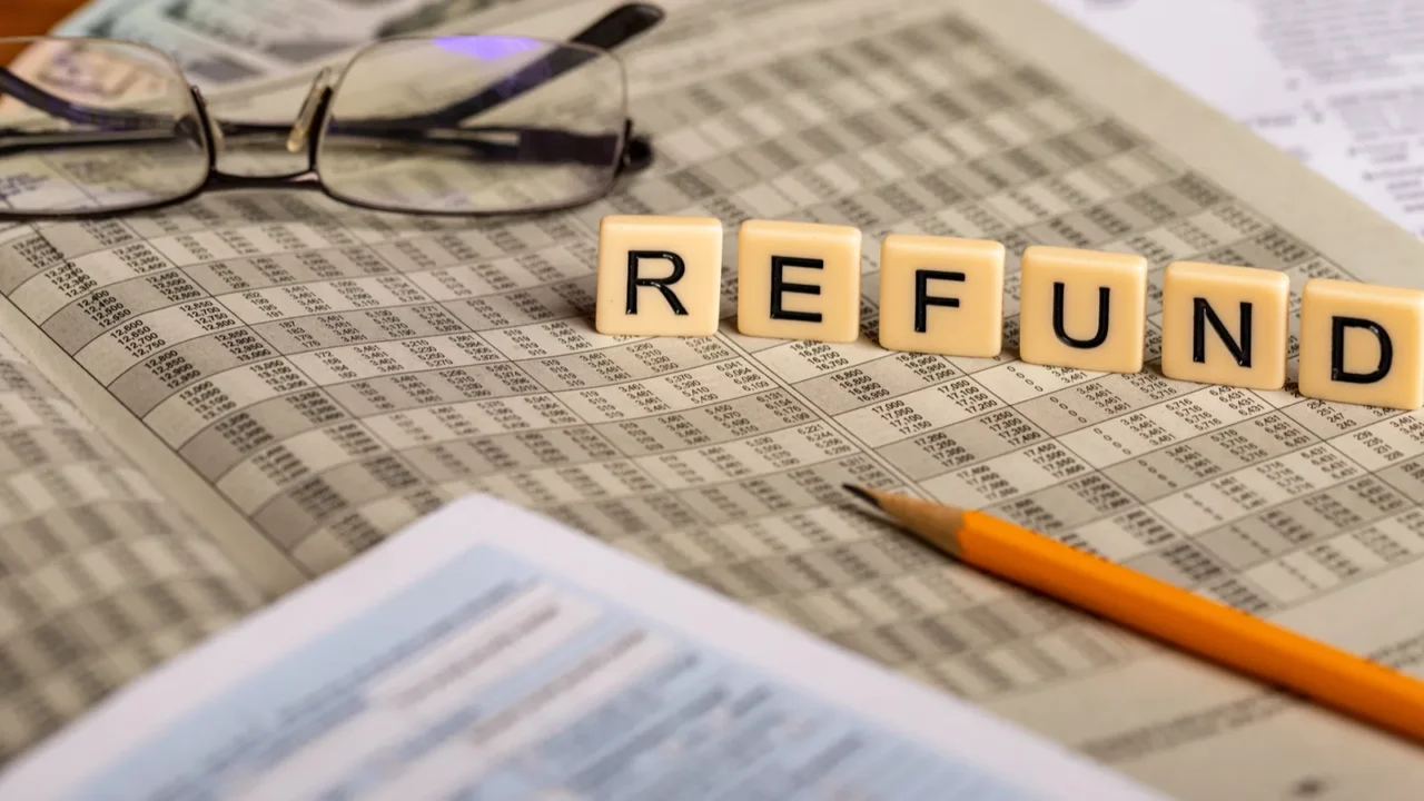 concept image ot tax refund with forms pencil glasses and