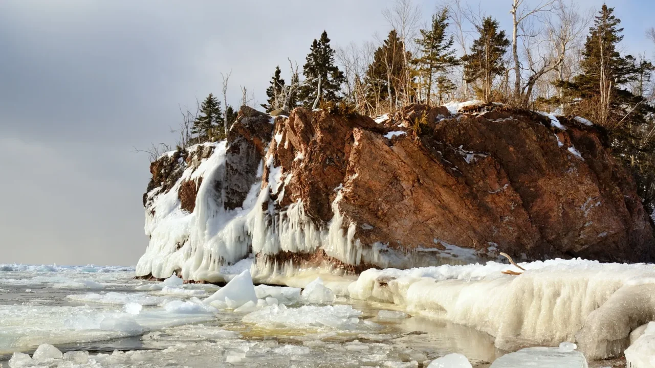 ice and rocky shoreline in winter