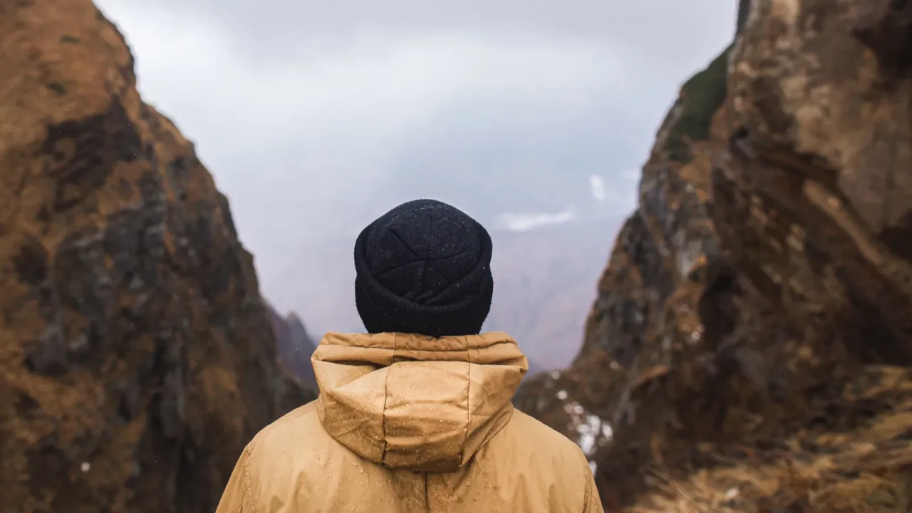 landscape view of misty autumn mountain hills and man silhouette