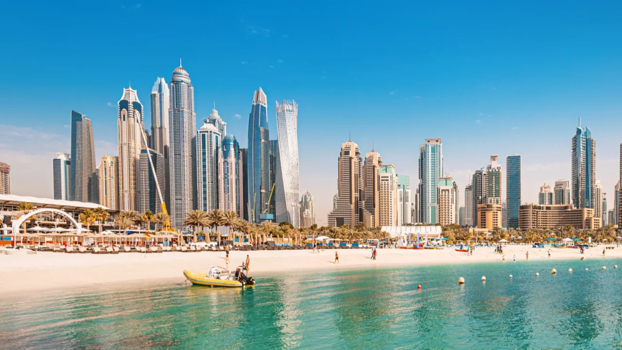 luxurious and spectacular sandy beach with vacationers in the dubai