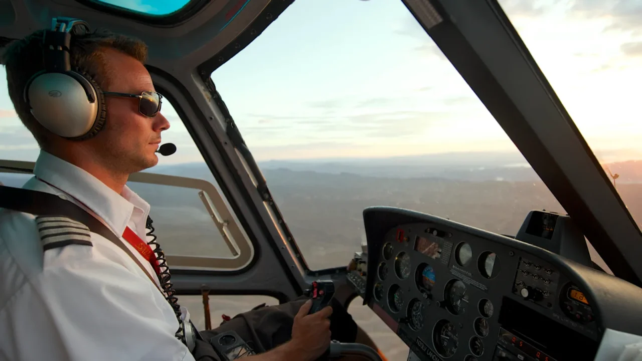 man pilots helicopter to grand canyon at sunset circa las