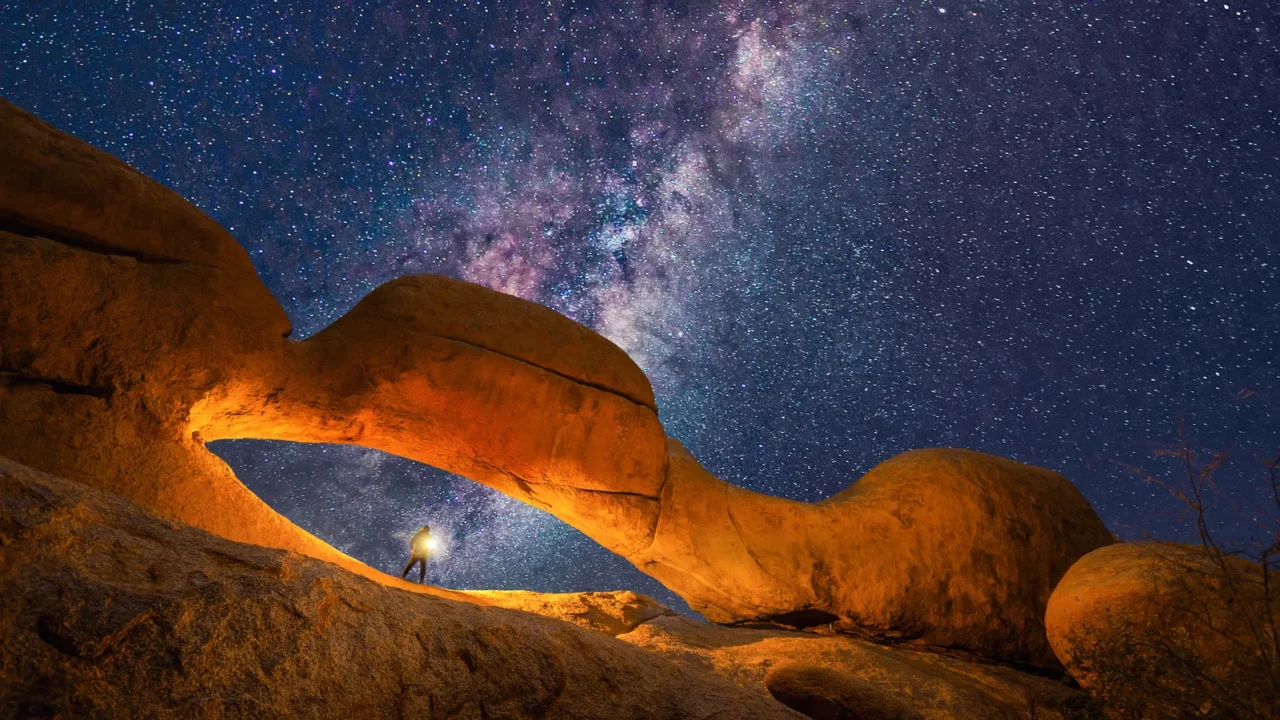 milky way and stars in red desert safari with sand