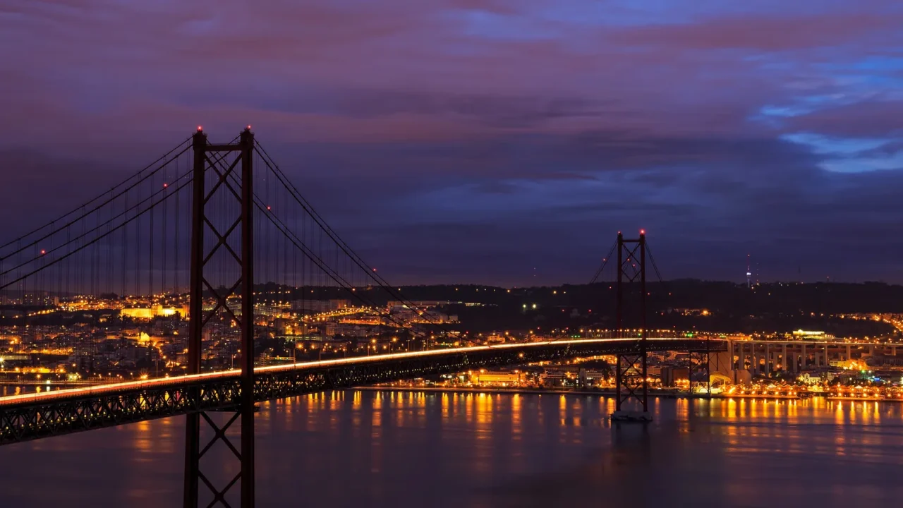 night view of lisbon and 25th of april bridge portugal
