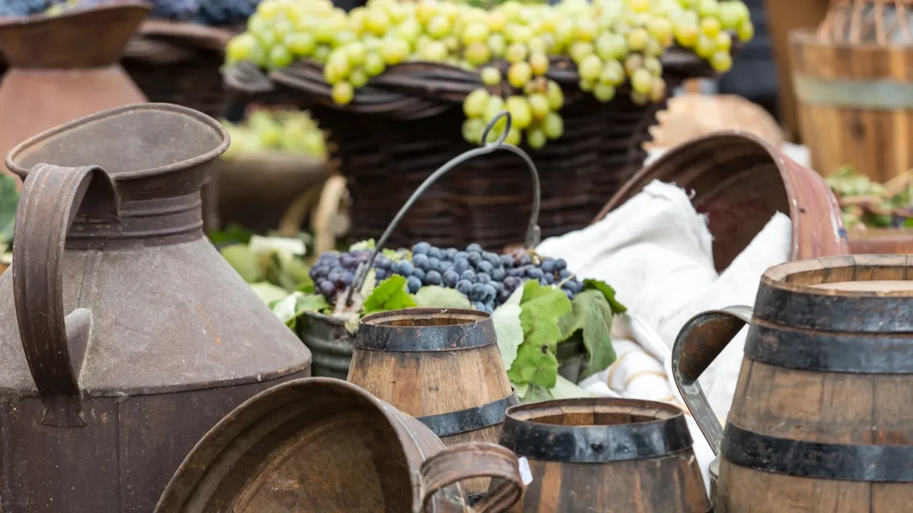 old barrels and tools for wine production and baskets