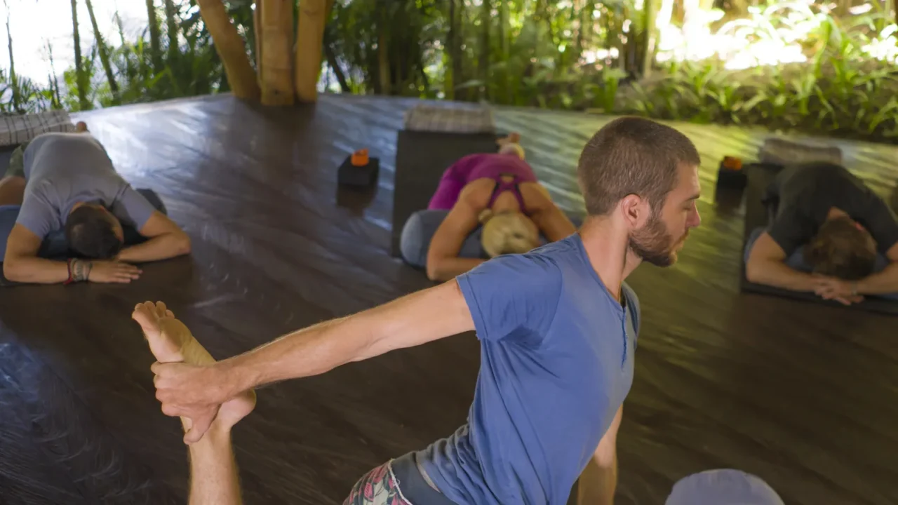 outdoors yoga lesson  group of young people and coach