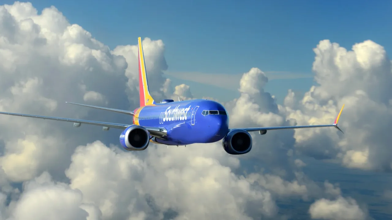 Southwest Airlines Boeing 737_800 MAX in flight with beautiful clouds as background.