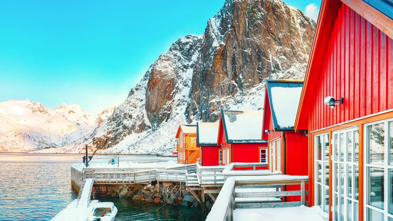 traditional norwegian red wooden houses rorbuer on the shore of