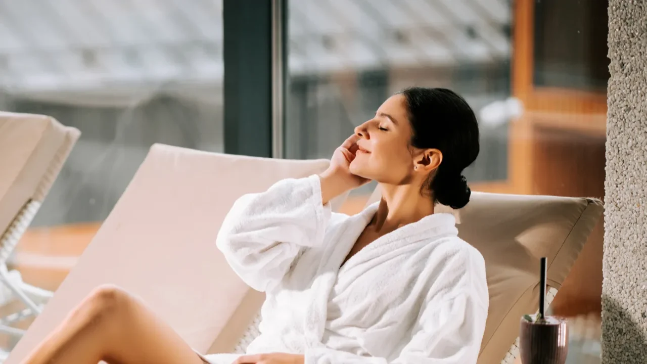 woman relaxing in a spa with a cocktail enjoying tranquility