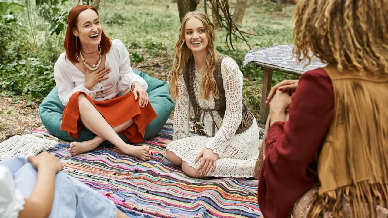 women retreat carefree multiethnic boho style girlfriends talking on colorful
