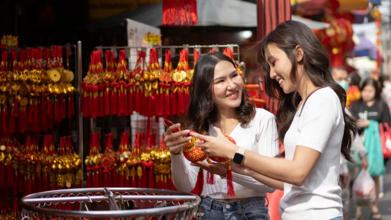 young asian women happily browsing and purchasing beautiful decoration items