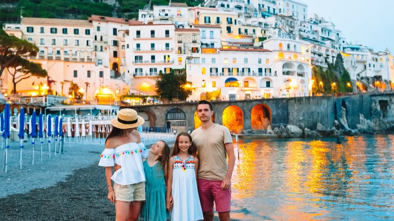 adorable little girl on sunset in amalfi town in italy