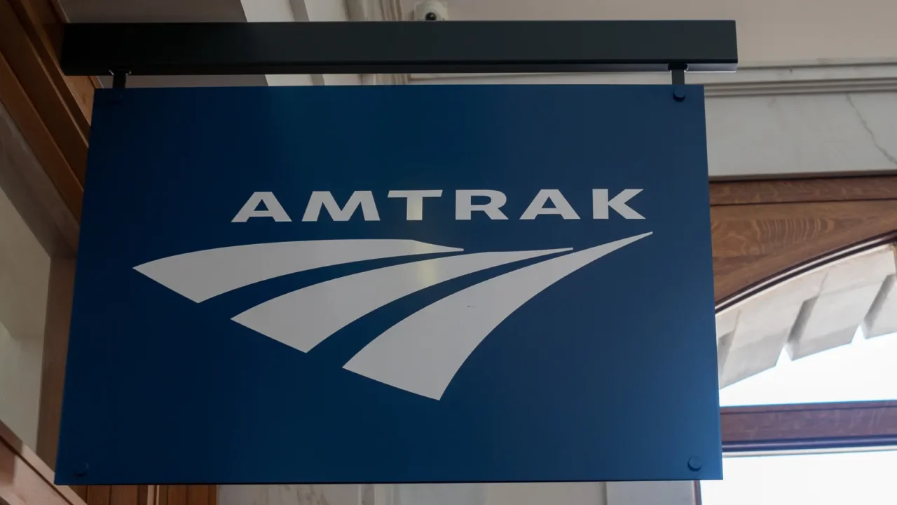 amtrak sign hanging outside of terminal location