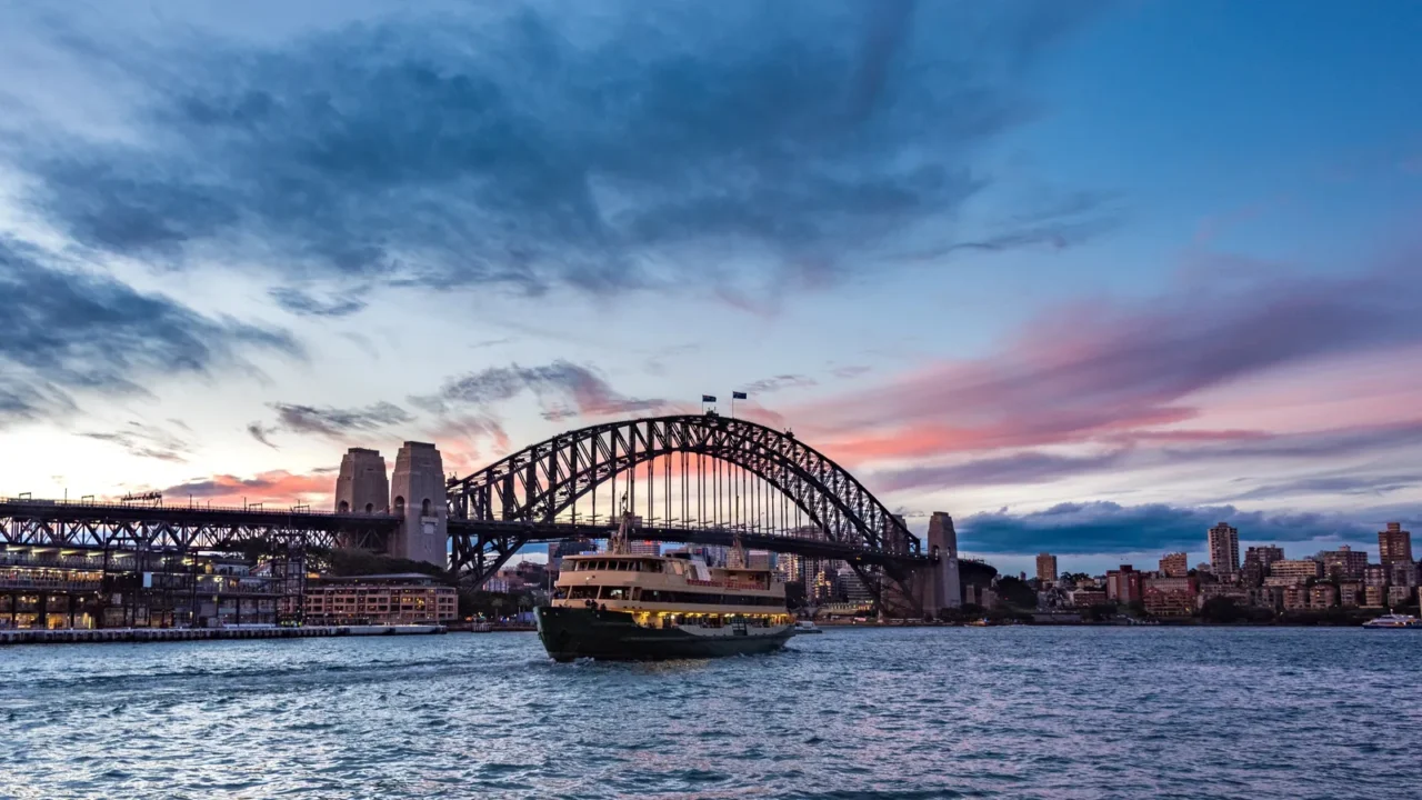 australian iconic landmark sydney harbour bridge against picturesque sunset sky