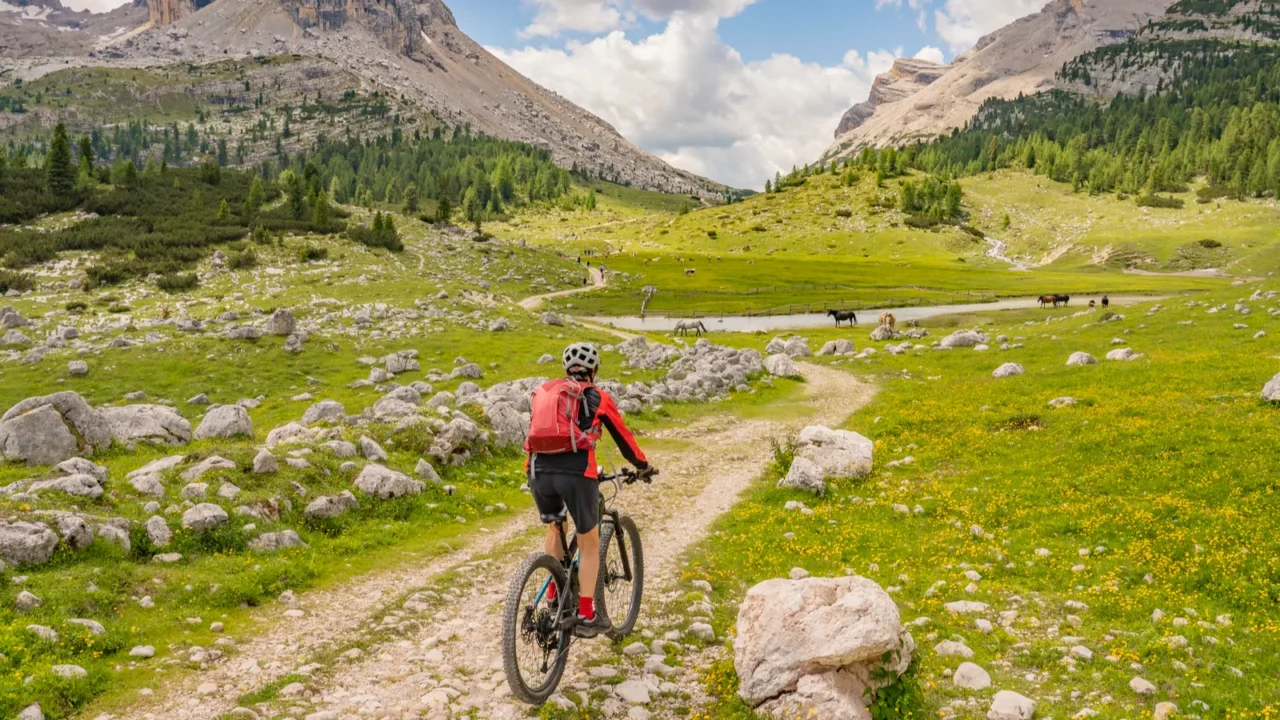 beautiful senior woman riding her electric mountain bike in the