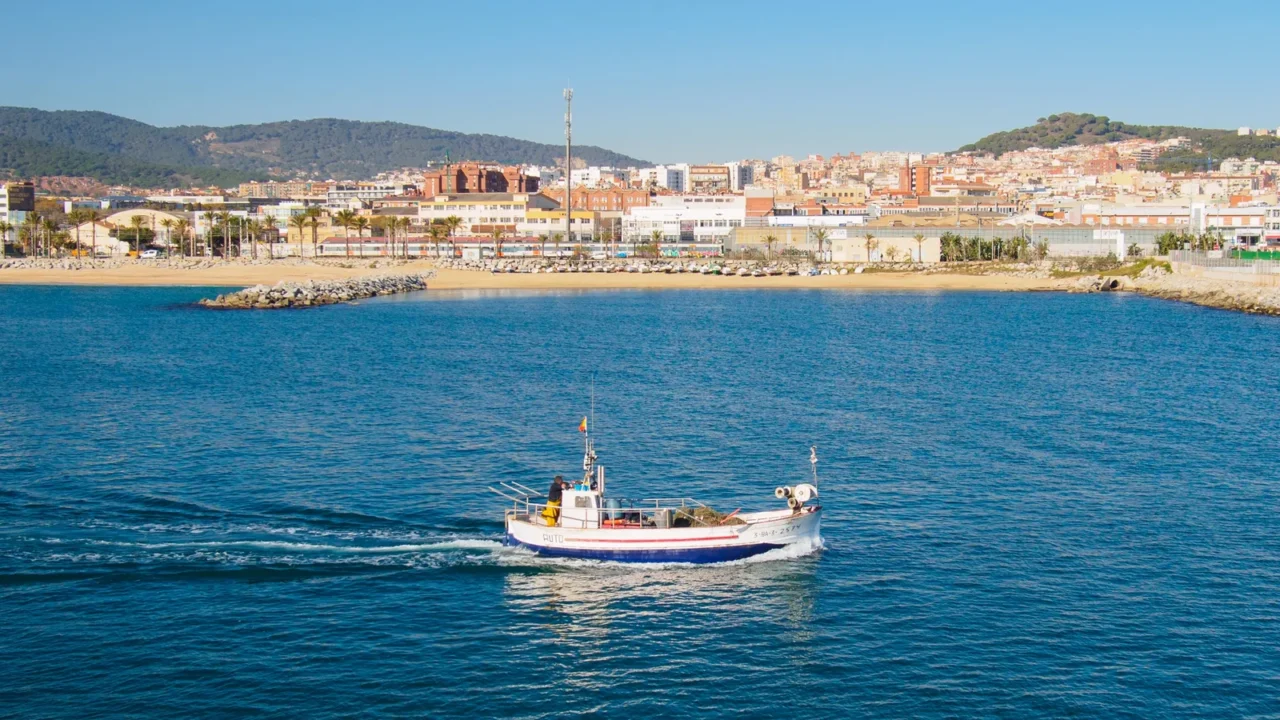 boat sailing off mataros beach