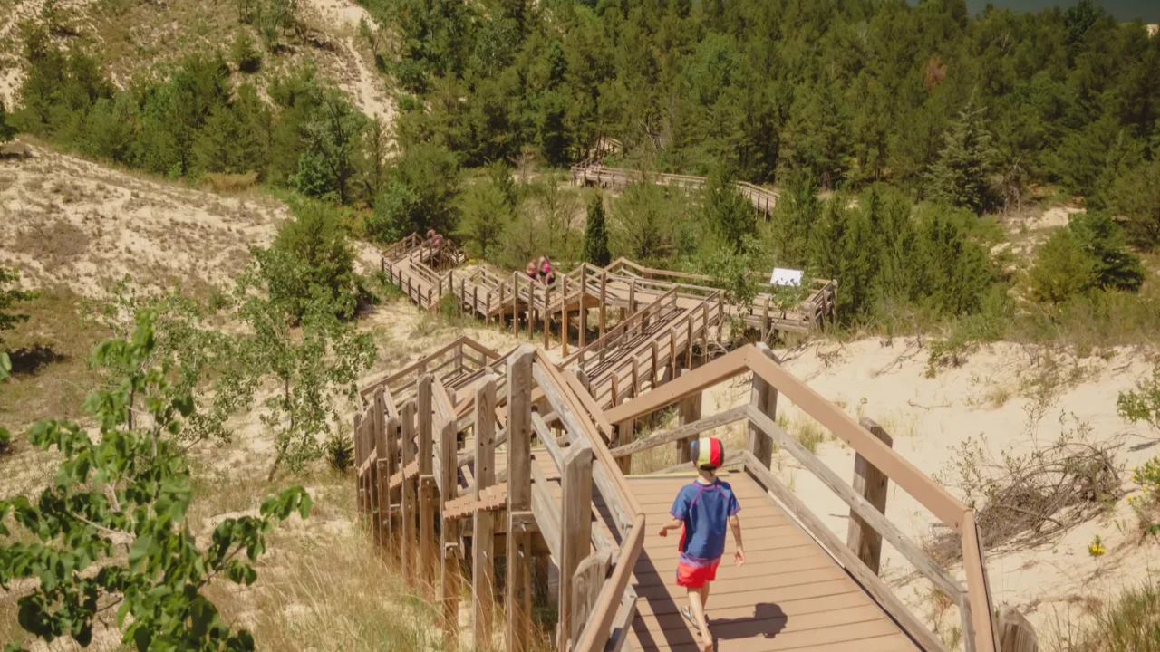 boy hiking along dune succession trail in indiana dunes national