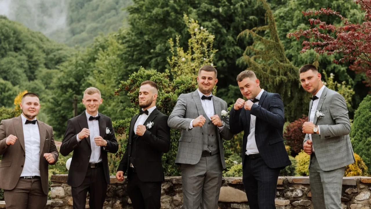 cheerful young energetic witnesses of the groom next to the