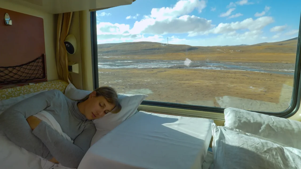 close up tired girl sleeps in her sleeper cabin during