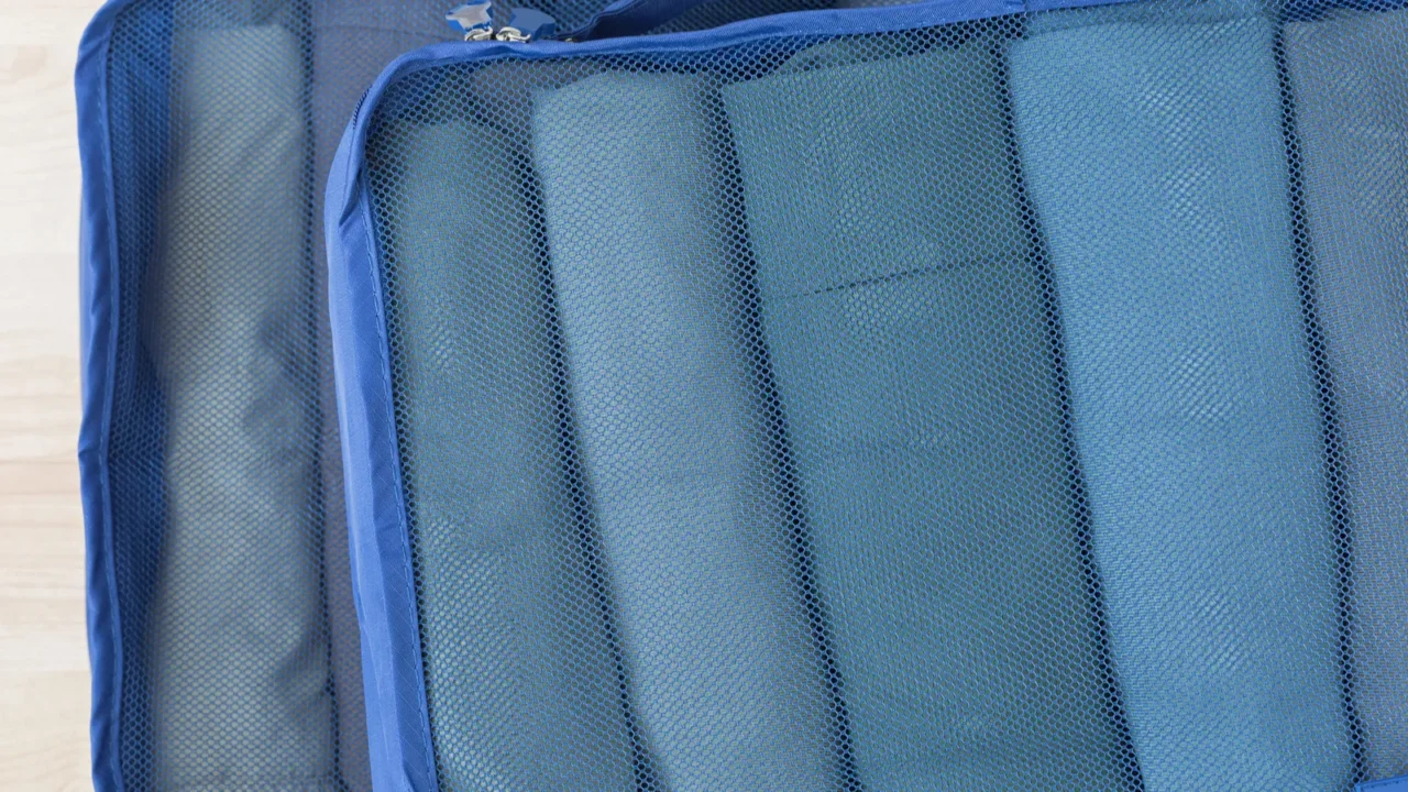 cube meshed bags with rolled clothes tshirt pants set of