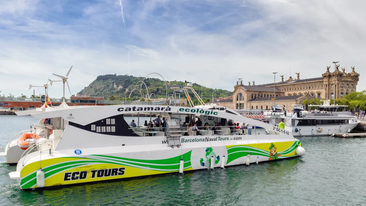ecological excursion catamaran sailing at seaport of barcelona town