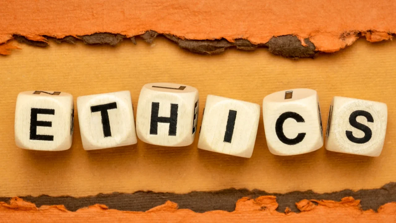 ethics word wooden cubes on handmade paper in