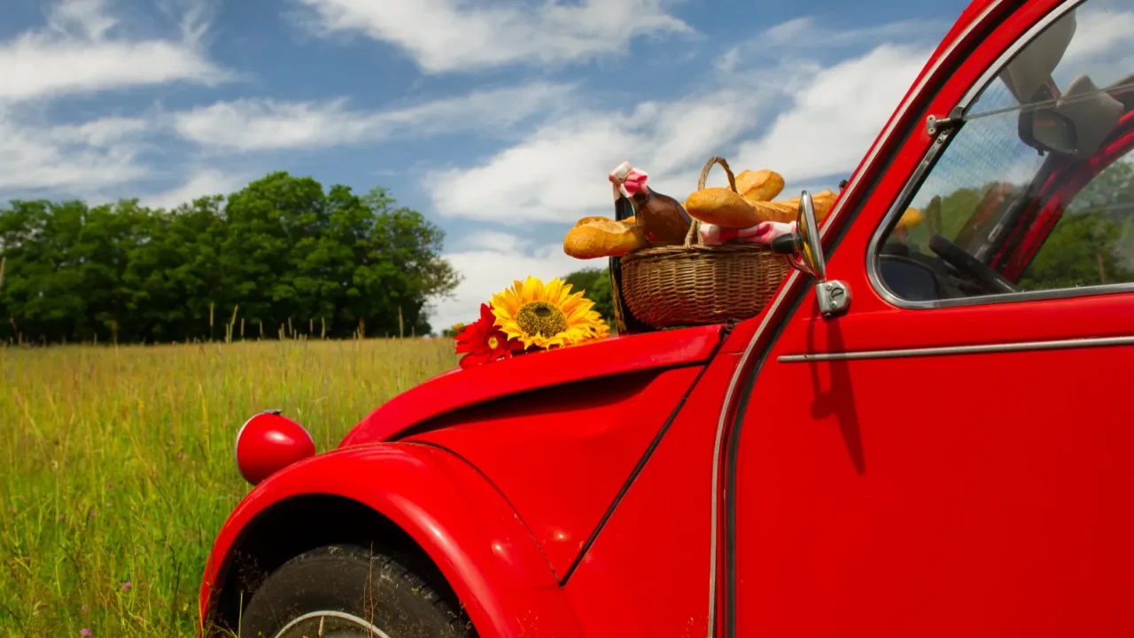french car with bread and wine