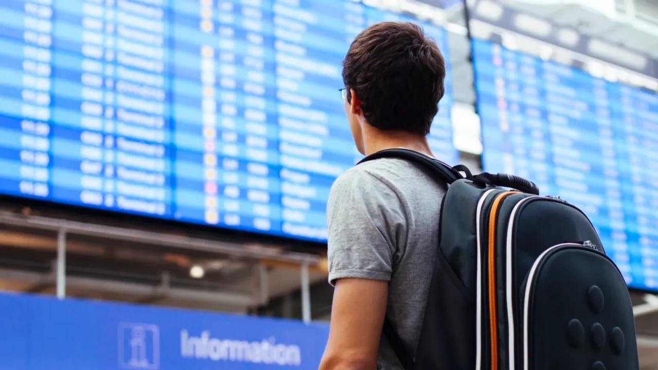 guy near airline schedule