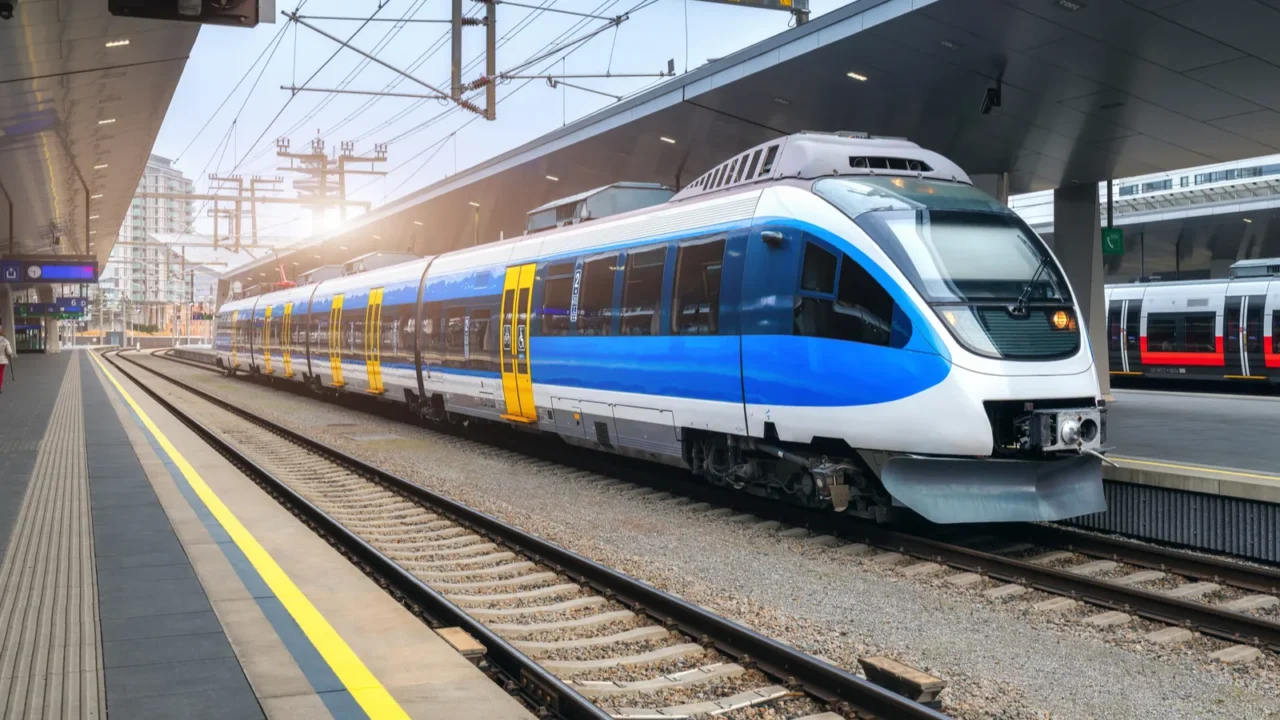 high speed train on the train station at sunset in