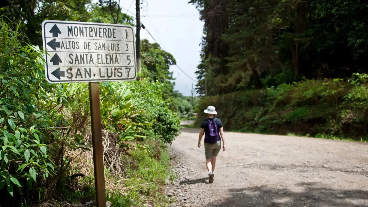 hiker near sign in santa elena costa rica