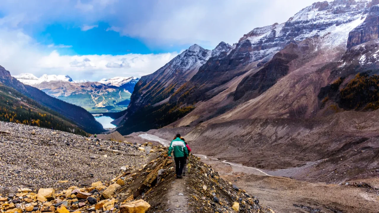 Hiking down to Lake Louise on a lateral moraine on the hiking trail from the Plain of Six Glaciers in Banff National Park in the Canadian Rocky Mountains.