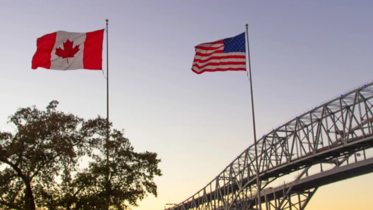 international border crossing sunset at the blue water bridge border