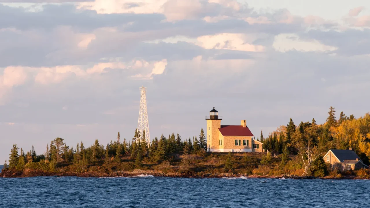 lighthouse and gathering clouds in evening light