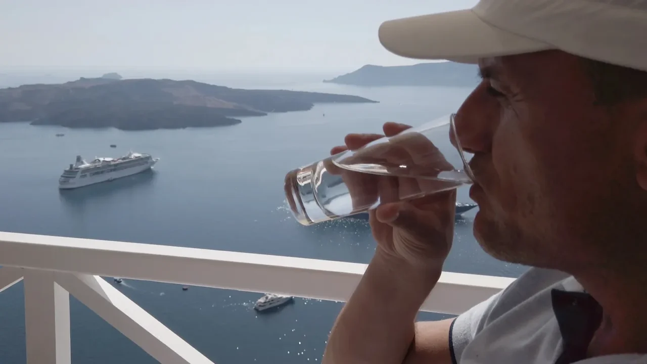 man drinking frappe coffee enjoying summer vacation at luxury hotel