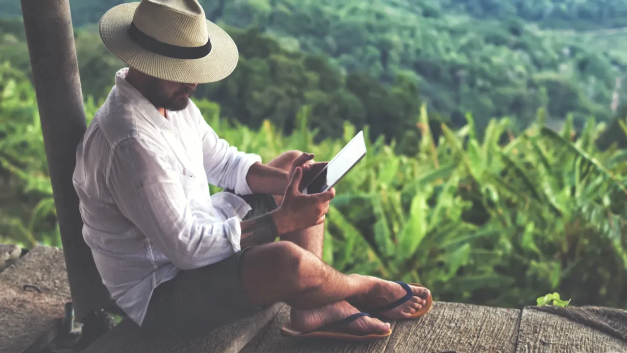 man traveler using digital tablet
