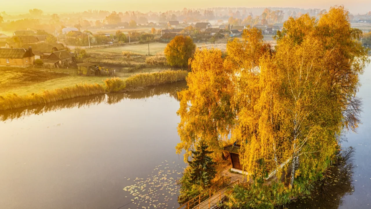 morning landscape wooden hunting lodge on a small manmade island